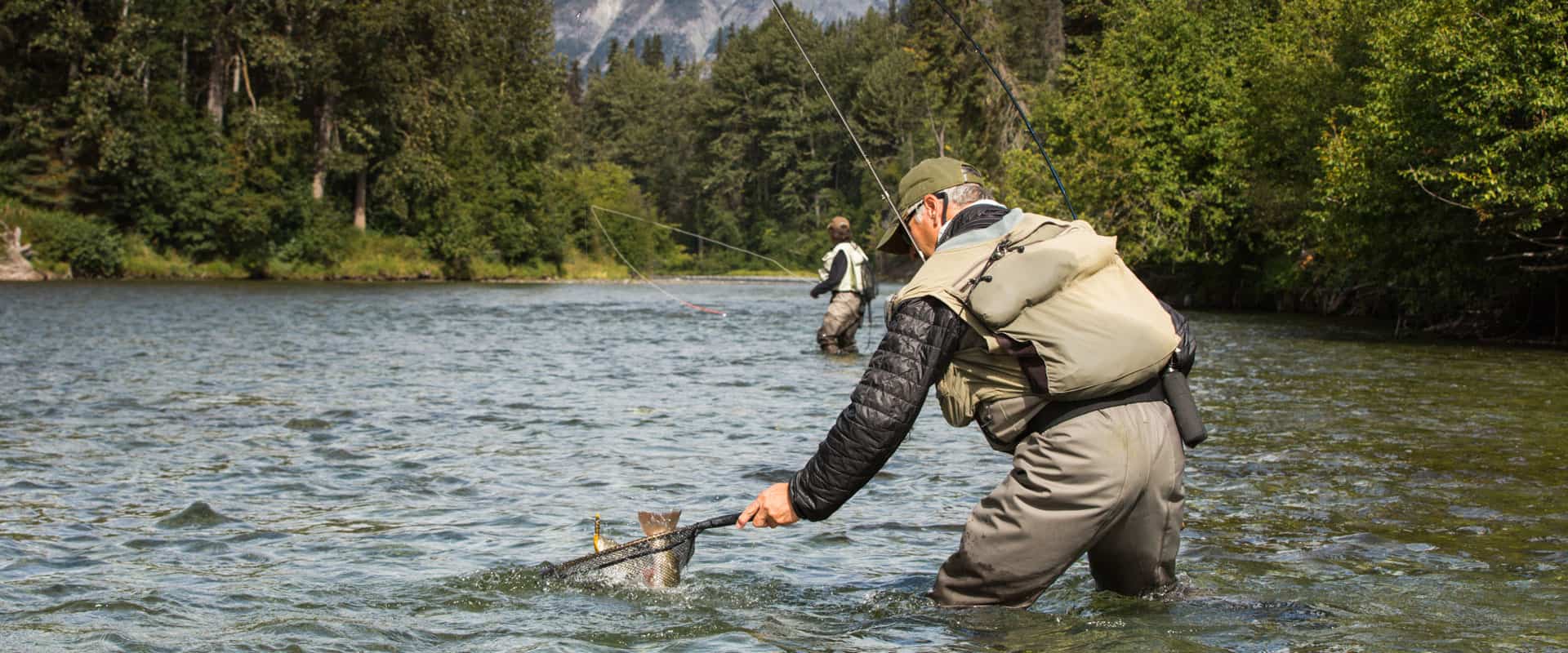 Photo of two men salmon fishing